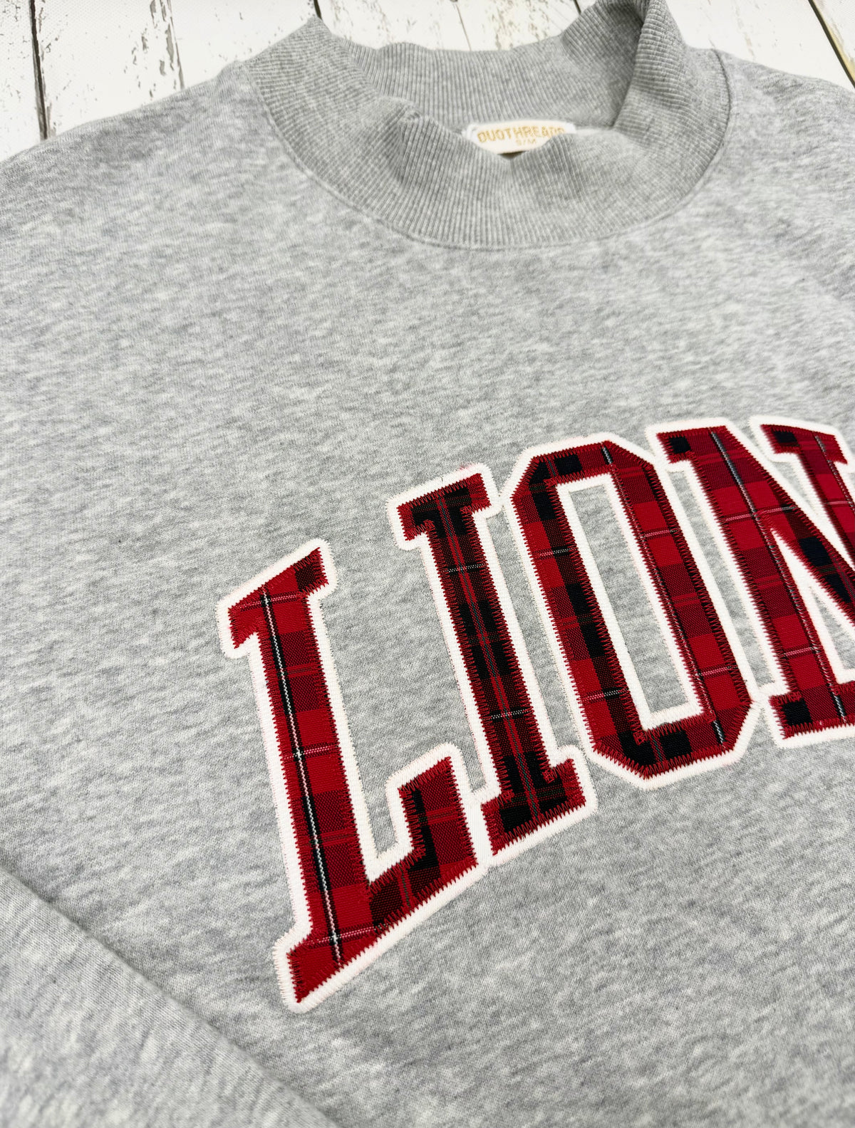 DT LIONS Faith Plaid Mock Neck